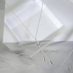 Verstellbare Halskette aus Sterlingsilber mit Kugel und doppelter Quaste